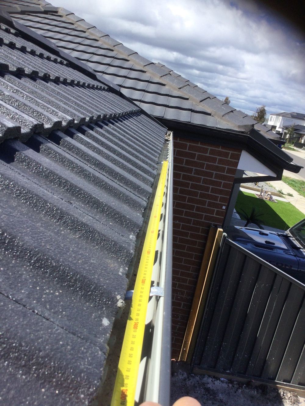 Gutter brackets spaced beyond the 1,200mm maximum, leaving the gutter unsupported, found during a pre-handover inspection in Wollert