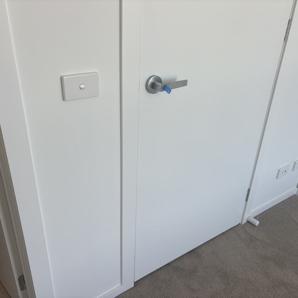 Door rattling because of a gap at the latch, needing the strike plate adjusted, Wollert