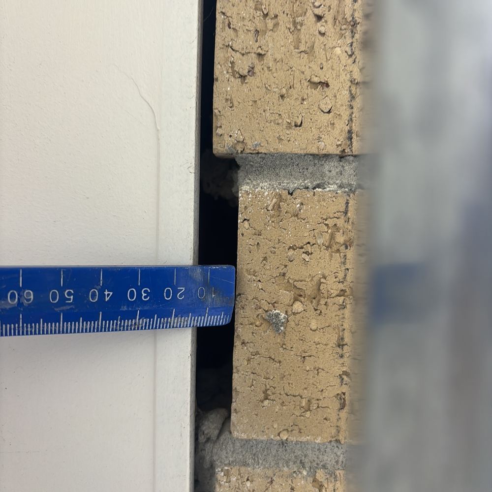 Excessive gap between the garage door and wall, letting birds and animals in, Wollert