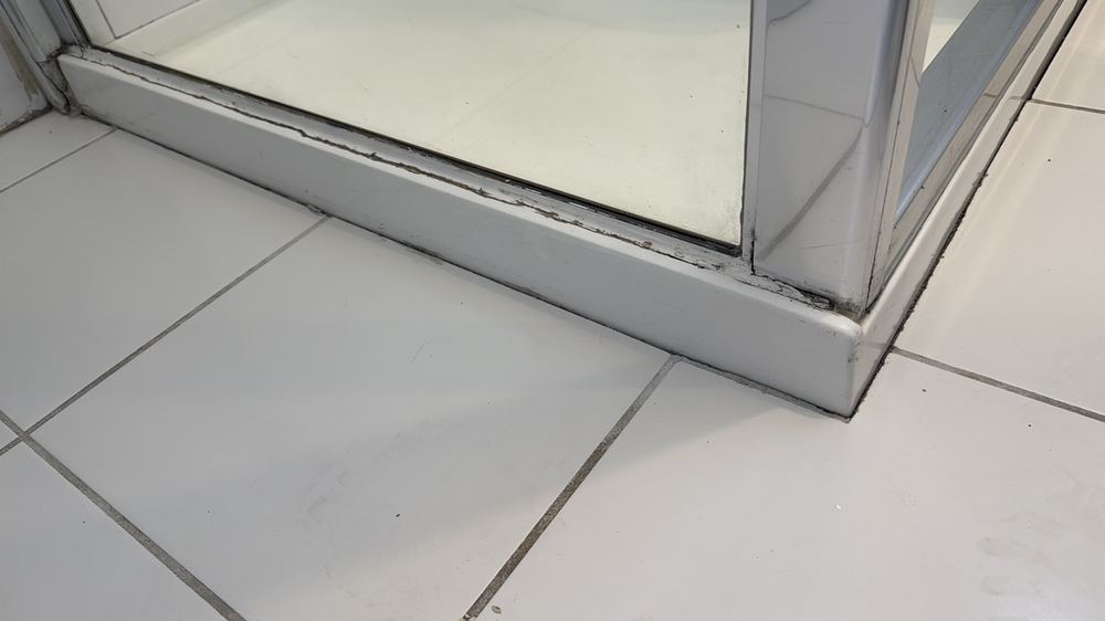 Old sealant missing and degraded, which can let moisture into the wall, found during a pre-purchase inspection in Preston