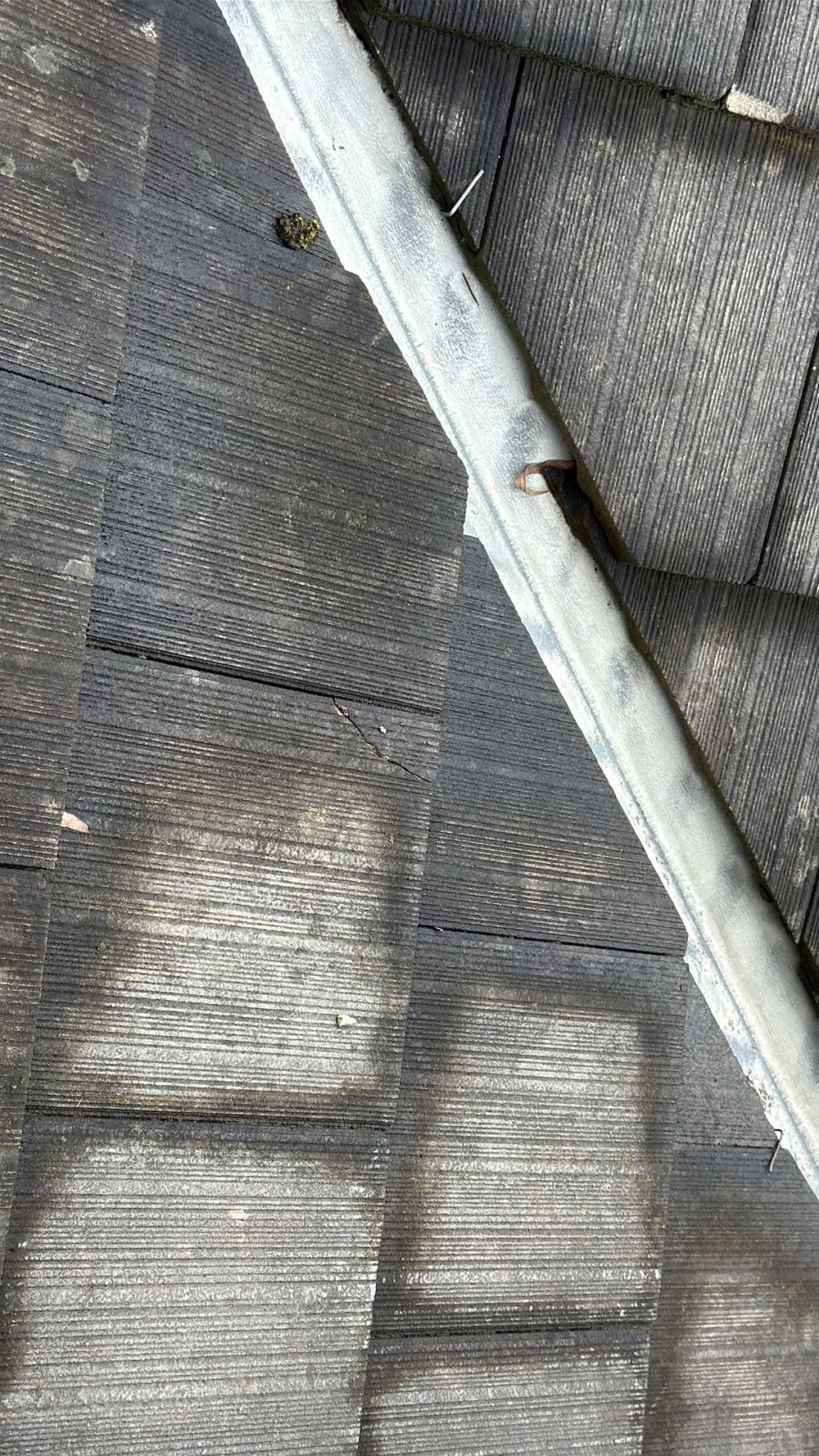 Cracked and broken roof tiles that could let water in and need replacing, found during a defect investigation inspection in Mernda